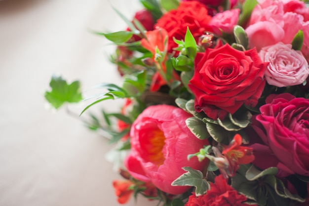 Wedding decor. Red Flowers in the restaurant, table setting