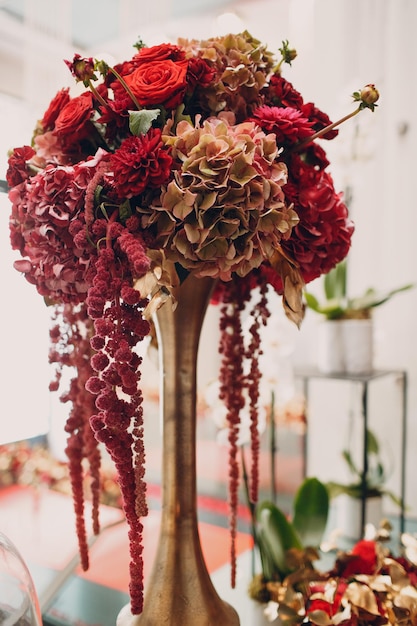 Wedding decor with vase and red flowers roses