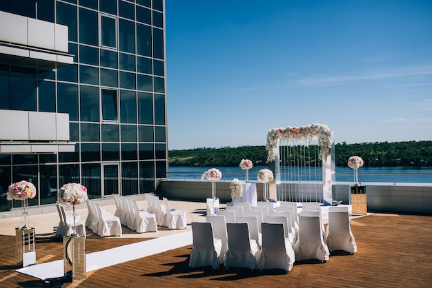 Wedding decorations from flowers and a wedding arch for the ceremony