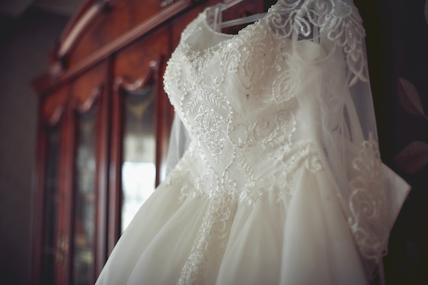 Photo wedding dress hanging.