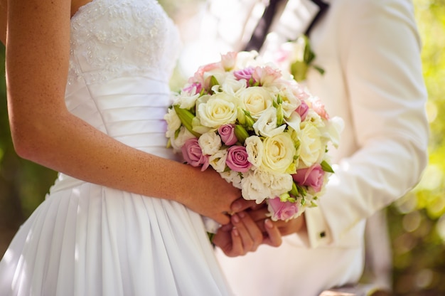 Wedding Flowers Bouquet in Bride and Groom Hands