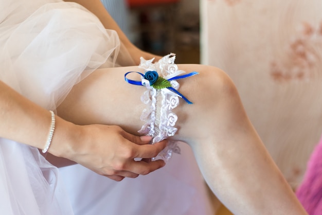 Wedding garter on the bride's leg