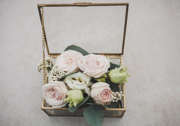 Wedding glass casket with flowers for the marriage ceremony