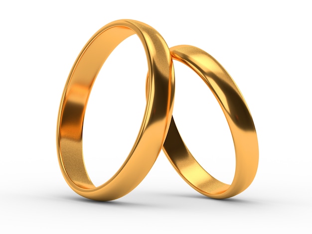 Wedding gold rings lie on each other