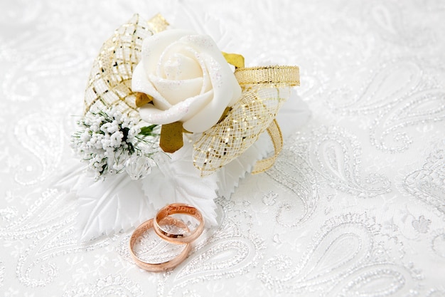 Wedding gold rings on a white pillow