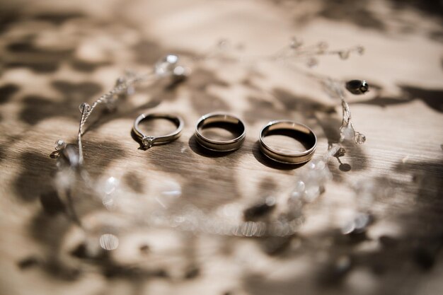 Wedding gold rings on a wooden table