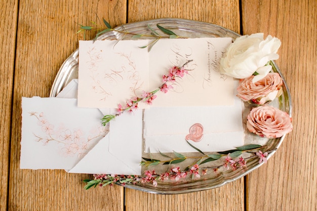 Photo wedding invitations on old plate with roses