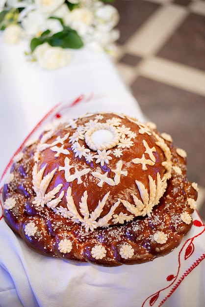 Wedding loaf on the banquet table Ukraine tradition pattern