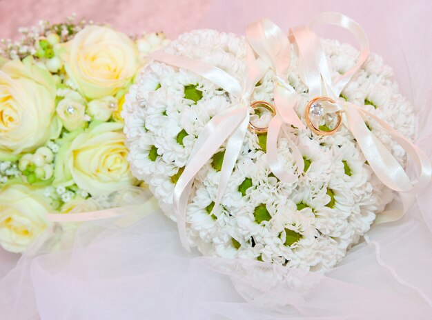 Wedding ornaments, ring on pillow in shape of heart