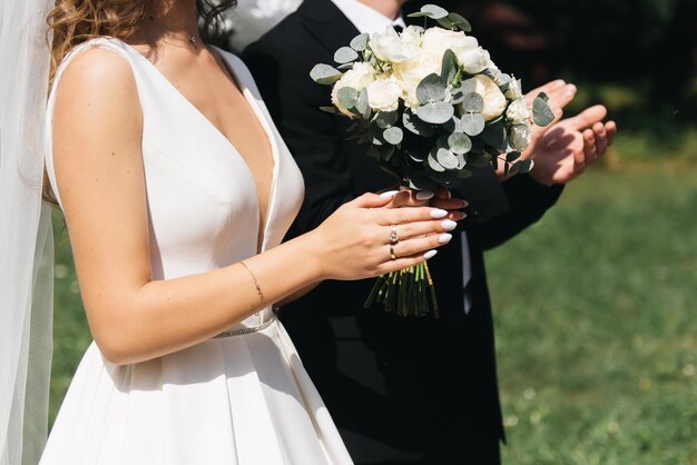 Wedding photo day The bride and groom hold hands