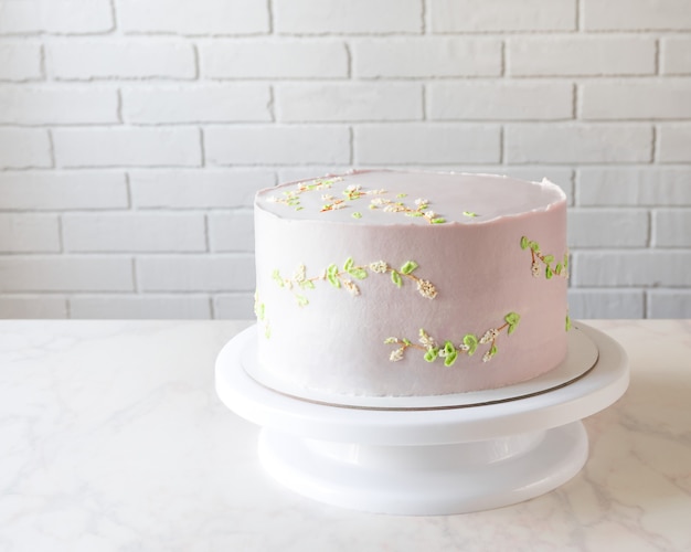 Wedding pink cake on a stand. delicate decor on cake.