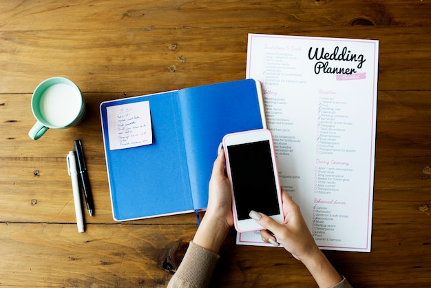 Wedding Planner Checklist Paper on Wooden Table