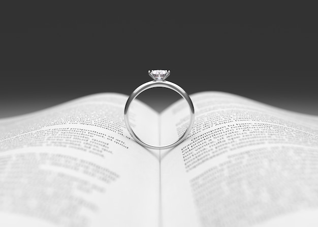 Wedding ring on the book page 3d rendering