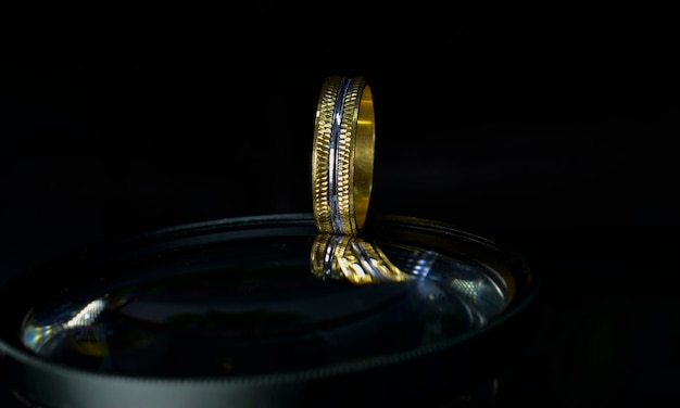 The wedding ring is a gold ring decorated with diamonds