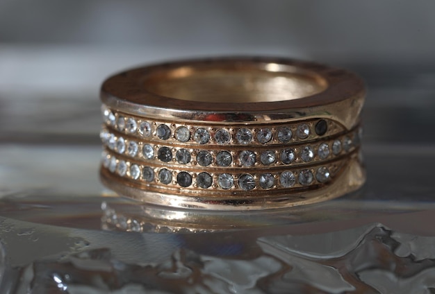 wedding ring with diamonds isolated on ice