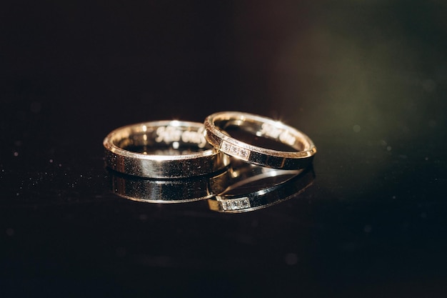 Wedding rings on black table