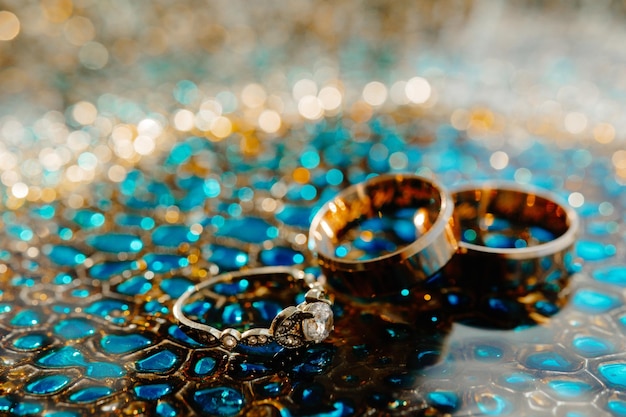 wedding rings on a blue background