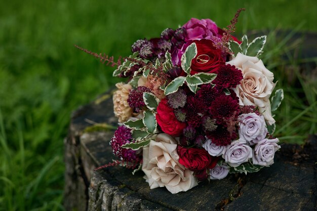 wedding rings on a bouquet of flowers