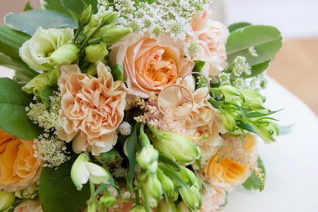 Wedding rings on a bouquet of roses