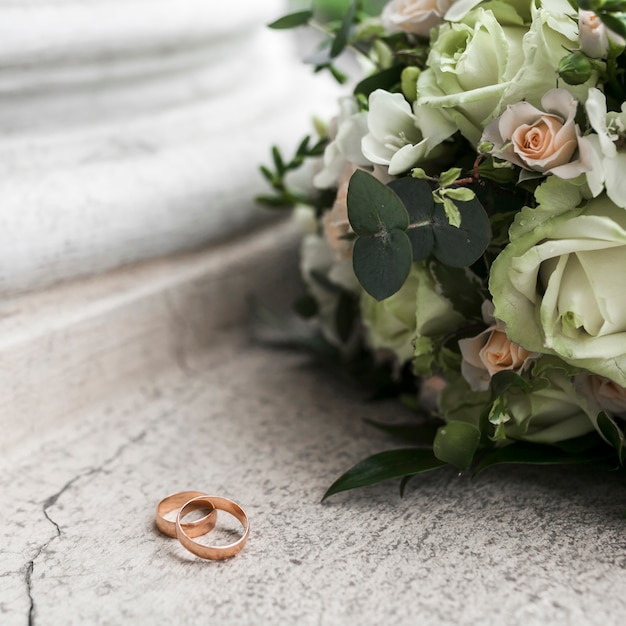 Wedding rings and bouquet