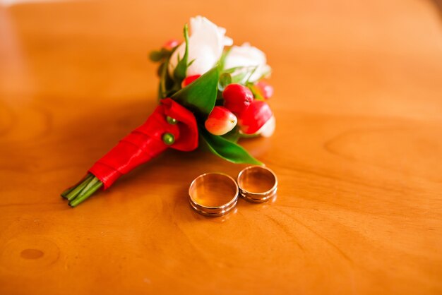 Wedding rings and boutonniere.