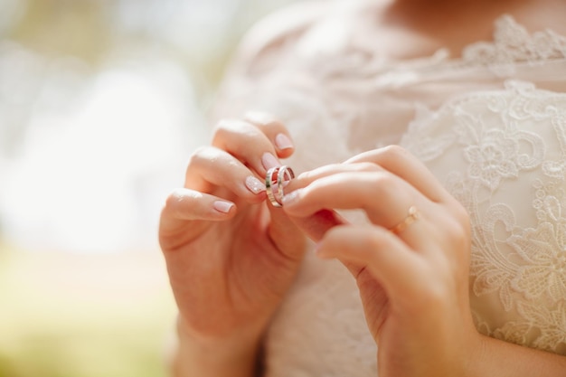 Wedding rings in brides hands macro