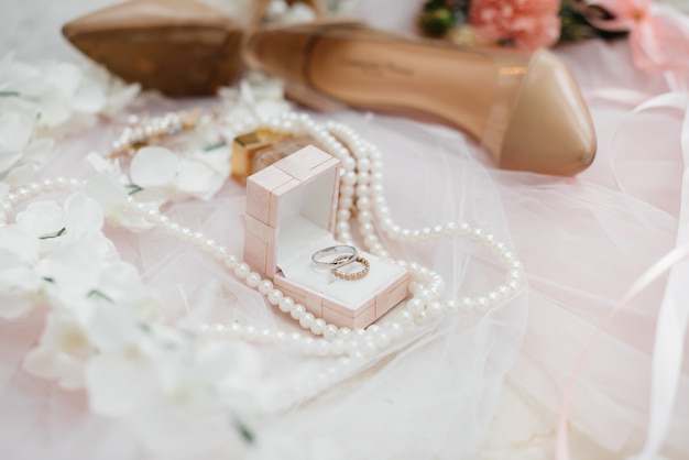 Wedding rings and other accessories close-up during the bride's gathering. Wedding.