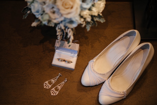 Wedding rings and other accessories close-up during the bride's gathering. wedding.