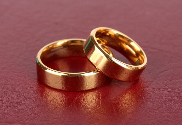 Wedding rings on red background