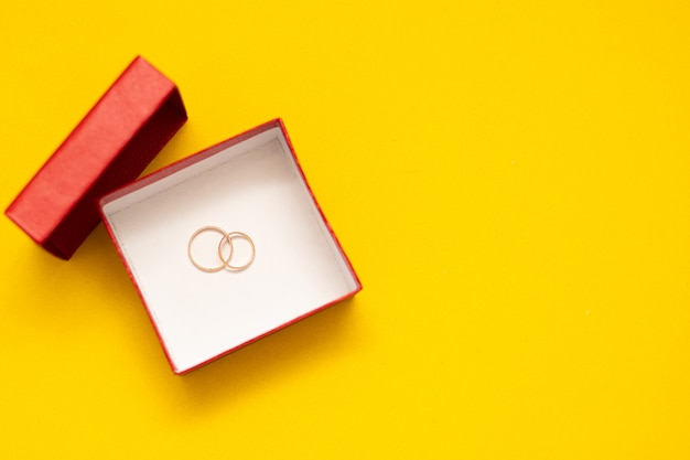 Wedding rings in a red box.