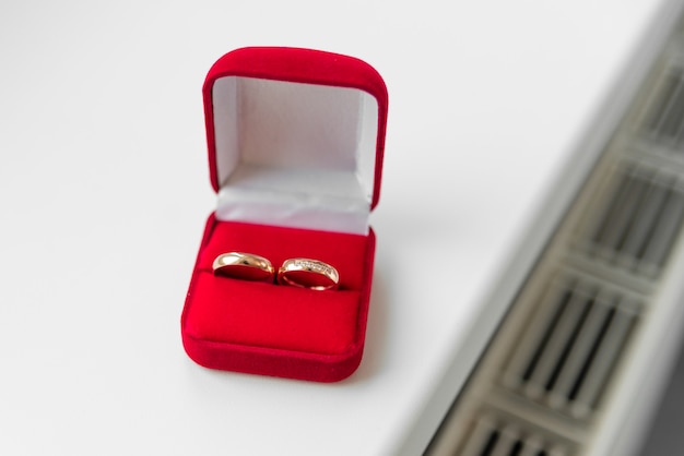 wedding rings in a red velvet box