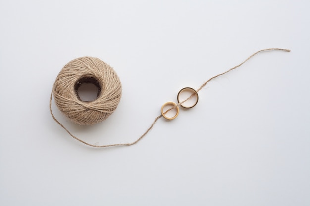 Wedding rings tied with thread