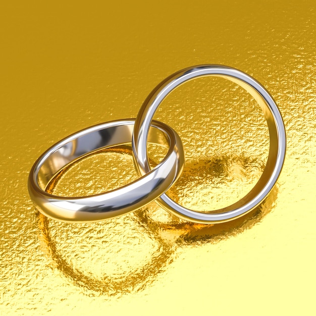 Wedding rings in white gold on a gold background