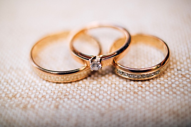 Wedding rings with beautiful carvings on the sand