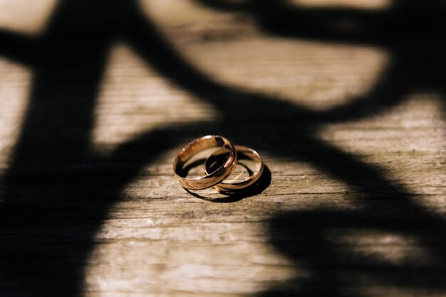 Wedding rings on a wooden background