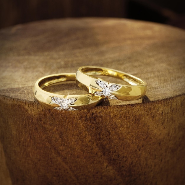 wedding rings on wooden background