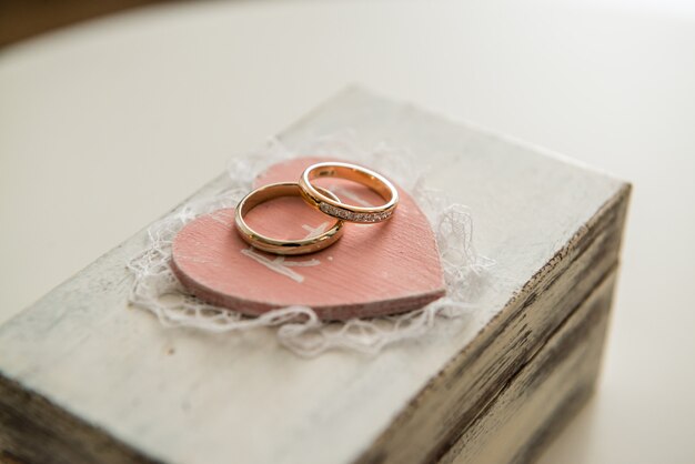 Wedding rings on a wooden box