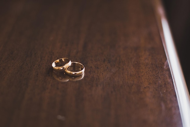 Wedding rings on a wooden table 5932