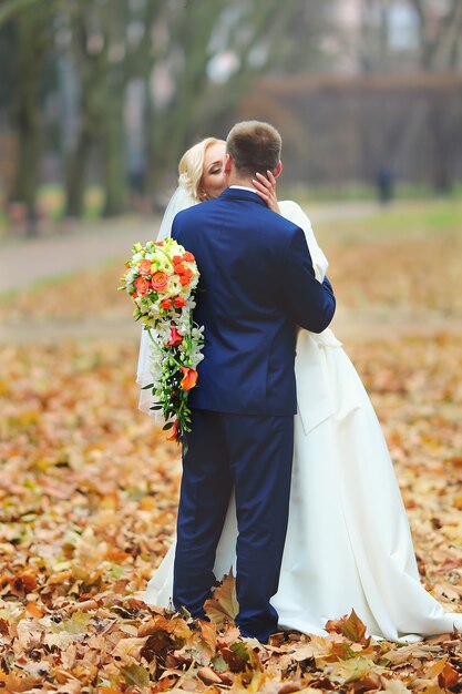 Wedding shot of bride and groom in park