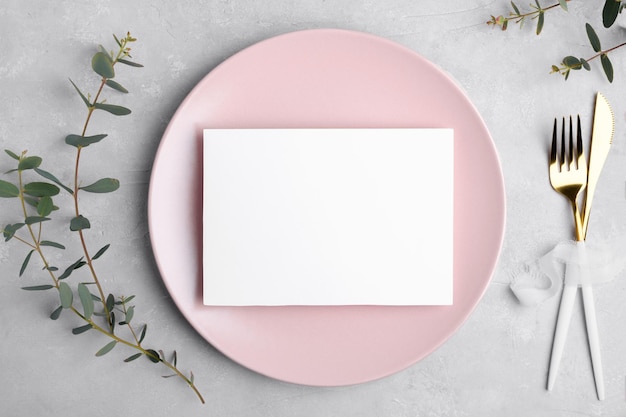 Wedding stationery invitation card mockup 7x5 on grey background with eucalyptus Menu card mockup with festive wedding or birthday table setting pink ceramic plate Minimal blank card mockup