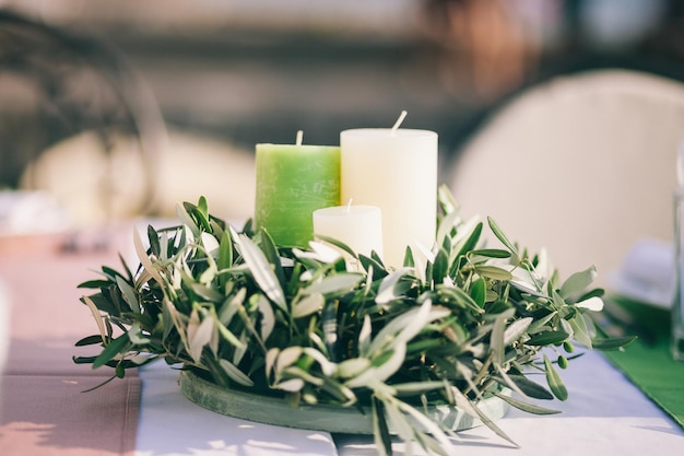 Wedding table candles and flowers decoration Olives