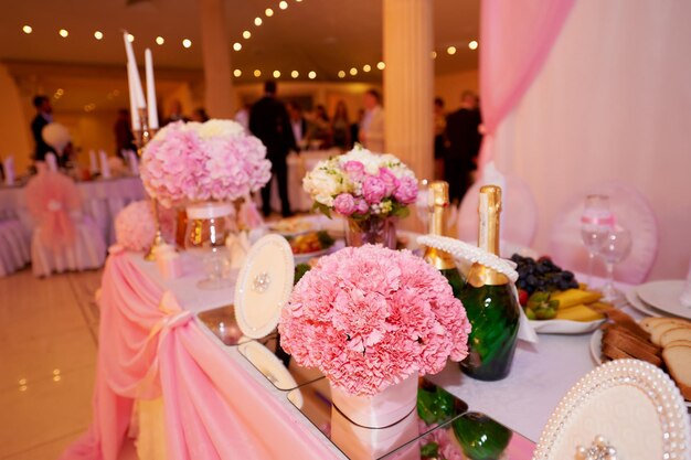 Wedding table decoration newlyweds decorated with pink peonies