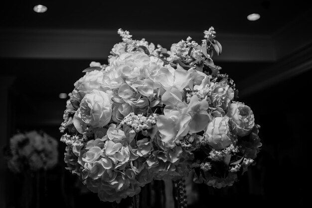 Wedding table flowers decor. banquet decoration in tender color, black and white photo