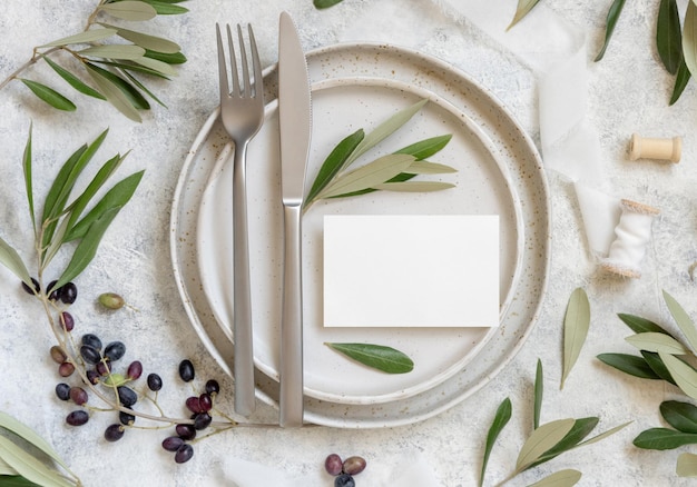 Wedding Table place with a card decorated with olive branches