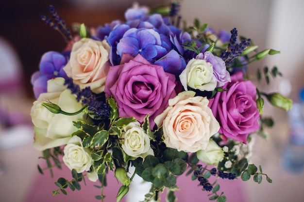 Wedding table setting with flowers blue, white, red