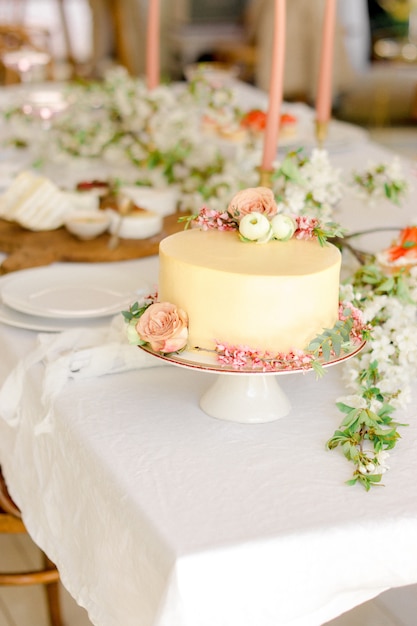 Wedding table setting with yellow cake