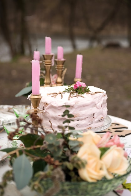 Wedding table with candles and cake closeup