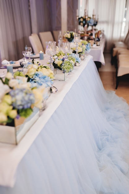 Wedding table with decorations in sky blue color. High quality photo