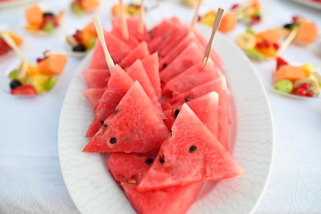 Wedding table with different kind of fruits Luxury gorgeous wedding buffet with watermelon