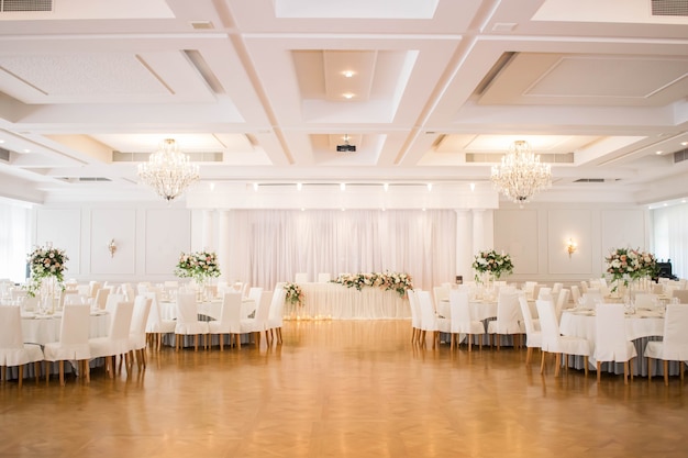 Photo wedding in white and gold colors. elegant wedding decorated with white flowers.